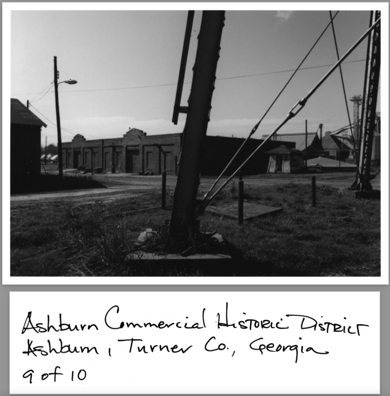 Ashburn Com. Hist. District Application Photo - 8 of 10 - Peanut Oil Warehouse, city waterworks; photographer facing west.png